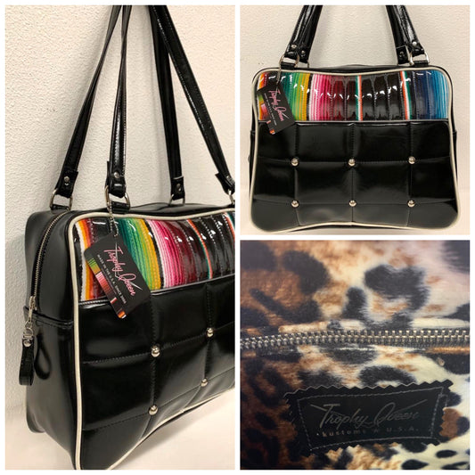 Lincoln Business Bag in Grease Black and Mexican Blanket with Clear Overlay and Plush Leopard Lining. The straps are 29” with nickel hardware and come with extra replacement straps! Inside has an open divided pocket and zipper pocket with hidden serial number. Tote comes with vinyl zipper pull, nickel fee and signature Trophy Queen label. Made with love in California.