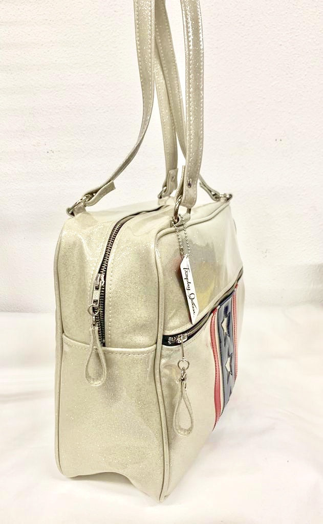 Evel Knievel GTO Business Bag with plush leopard lining, 29” straps with nickel hardware and comes with extra replacement straps! Inside has an open divided pocket and zipper pocket with hidden serial number. Tote comes with vinyl zipper pull, nickel fee and signature Trophy Queen label. Made with love in California.