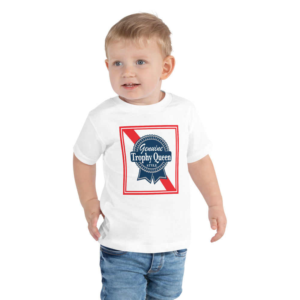 Let your toddler do their thing while feeling super comfy and looking extra stylish in this short-sleeve jersey t-shirt made from pre-shrunk, 100% cotton with a unique print of the Trophy Queen Blue Ribbon Logo. The tee is soft, durable, relaxed fit for extra comfort, and bound to become the staple of your toddlers wardrobe.