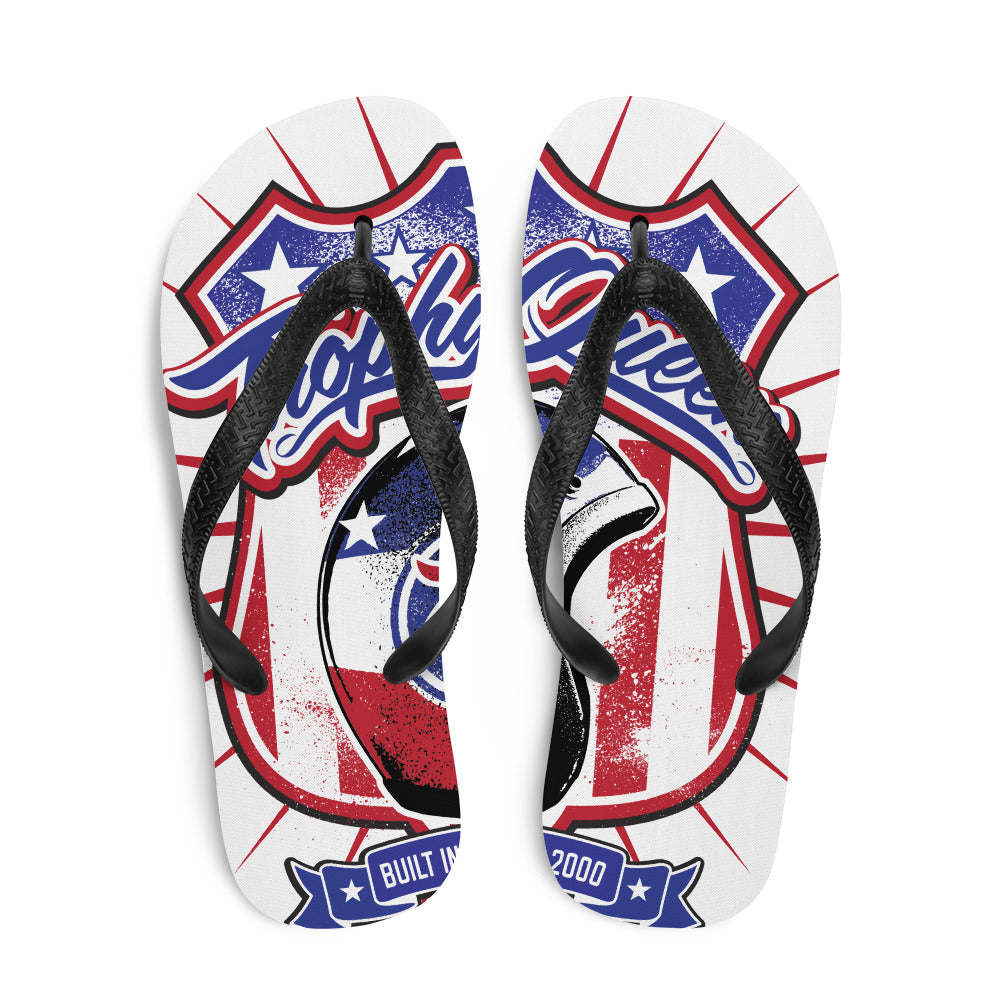Prepare for an adventurous and carefree summer with a pair of colorful slippers that are created just for you! The perfect beach shoe, these Trophy Queen Helmet Logo by American Artist Keven Carter flip-flops with rubber soles and soft fabric lining these slippers are sure to make you feel comfortable and look cool wherever your day takes you.