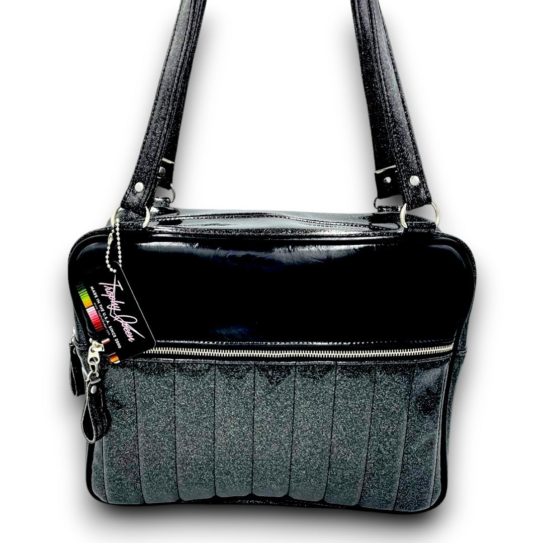 Fairlane Business Bag American Made Plush Leopard Lining Dimensions: 15" x 12" x 5” 29" Straps (Approx.) with Nickel Hardware Comes with an Extra Set of Replacement Straps! Inside Zipper Pocket (With Serial Number Inside) Inside Open Divided Pocket Inside Trophy Queen Label Vinyl Zipper Pull Nickel Feet Made to Order - Please Allow 2-3 Weeks to Ship