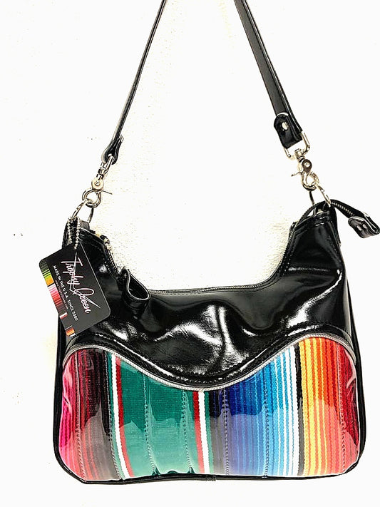 El Dorado Hobo Bag in Genuine Mexican Blanket and Grease Black Vinyl with plush leopard print lining handcrafted in California measuring approximately 12”x9”x2.5” (30.5cm x 23cm x 6cm) with inside open divided pocket and inside zipper pocket with inside hidden serial number and 26” should strap. Tote comes with vinyl zipper pull, nickel fee and signature Trophy Queen label. 
