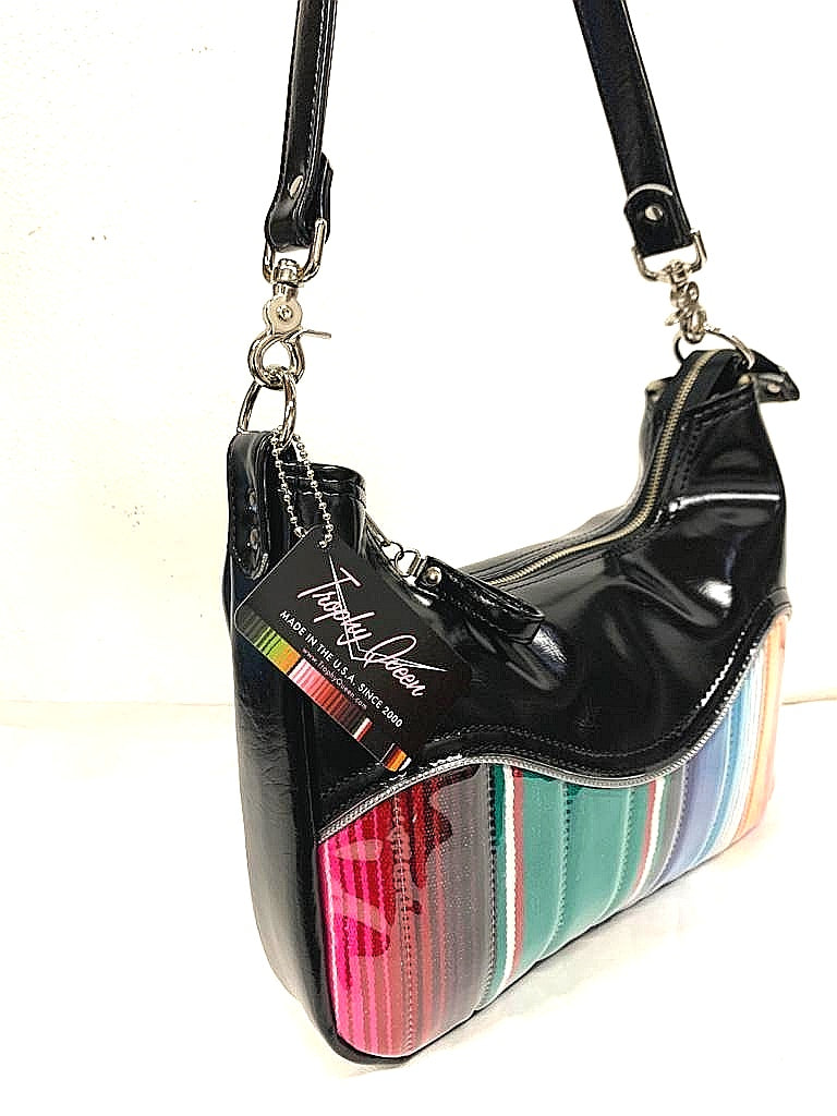 El Dorado Hobo Bag in Genuine Mexican Blanket and Grease Black Vinyl with plush leopard print lining handcrafted in California measuring approximately 12”x9”x2.5” (30.5cm x 23cm x 6cm) with inside open divided pocket and inside zipper pocket with inside hidden serial number and 26” should strap. Tote comes with vinyl zipper pull, nickel fee and signature Trophy Queen label. 