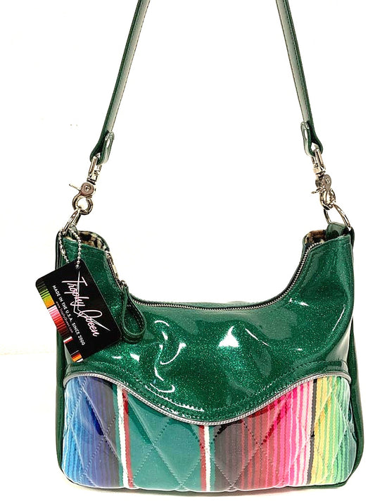 Pleated El Dorado hobo bag in green glitter vinyl and Mexican Blanket with plush leopard lining  handcrafted in California. Medium size featuring 26” shoulder strap, insize open divided pocket and inside zipper pocket. Signature Trophy Queen label inside and hidden serial number.