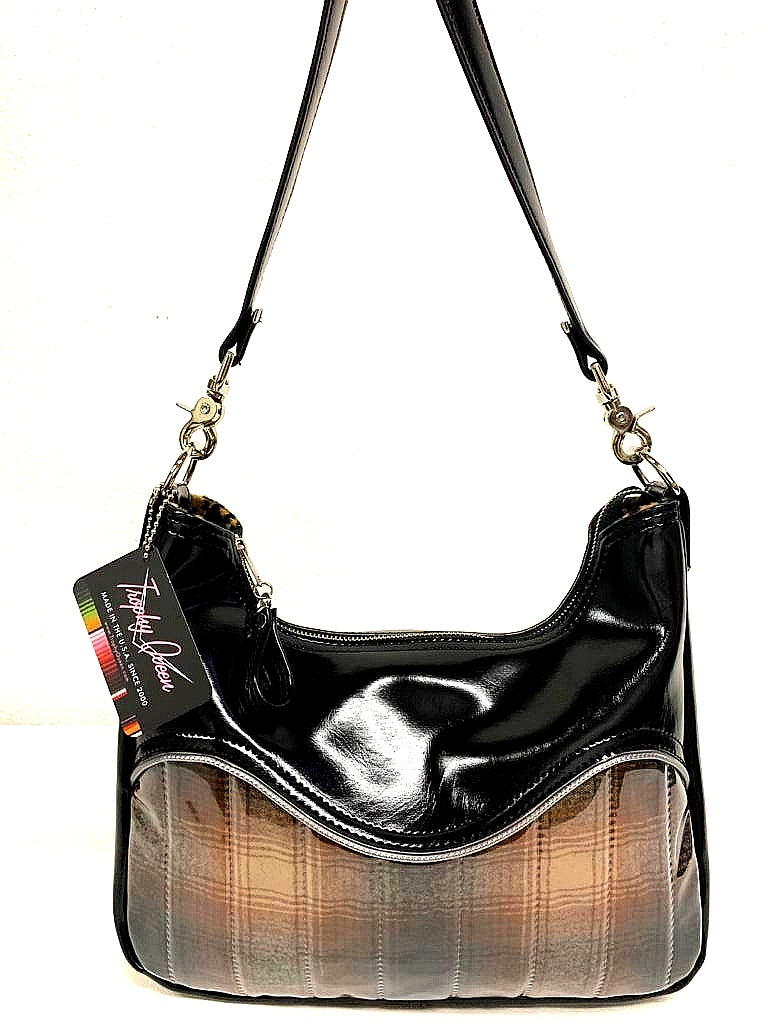 El Dorado Hobo Bag in Brown Pendleton Fabric and Grease Black with plush leopard print lining handcrafted in California measuring approximately 12”x9”x2.5” (30.5cm x 23cm x 6cm) with inside open divided pocket and inside zipper pocket with inside hidden serial number and 26” should strap. Tote comes with vinyl zipper pull, nickel fee and signature Trophy Queen label. 