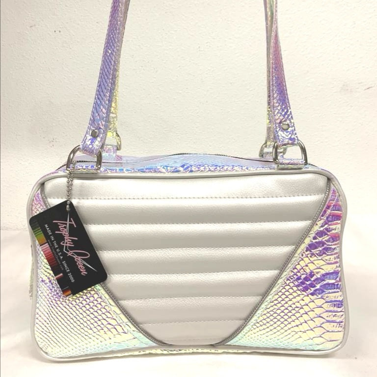 Limited Edition Mermaid and pearl white Comet Tote with plush leopard lining handcrafted in California with nickel hardware, an extra set of straps, vinyl zipper pull, inside open divided pocket, zipper pocket with serial number inside and signature Trophy Queen label.