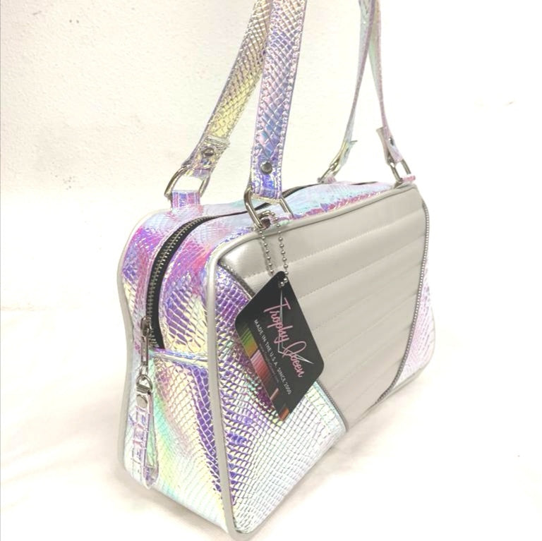 Limited Edition Mermaid and pearl white Comet Tote with plush leopard lining handcrafted in California with nickel hardware, an extra set of straps, vinyl zipper pull, inside open divided pocket, zipper pocket with serial number inside and signature Trophy Queen label.