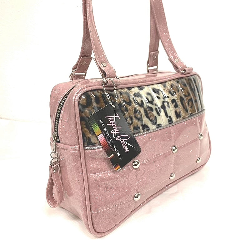 Lincoln Tote in Blush Pink Glitter and Leopard and Clear Overlay with Plush Leopard Lining. Made matching vinyl zipper pull, nickel feet, inside zipper pocket with serial number and open divided pocket with signature Trophy Queen label. The straps are approximately 25” and come with an extra set of replacement straps. Locally made and ships from California