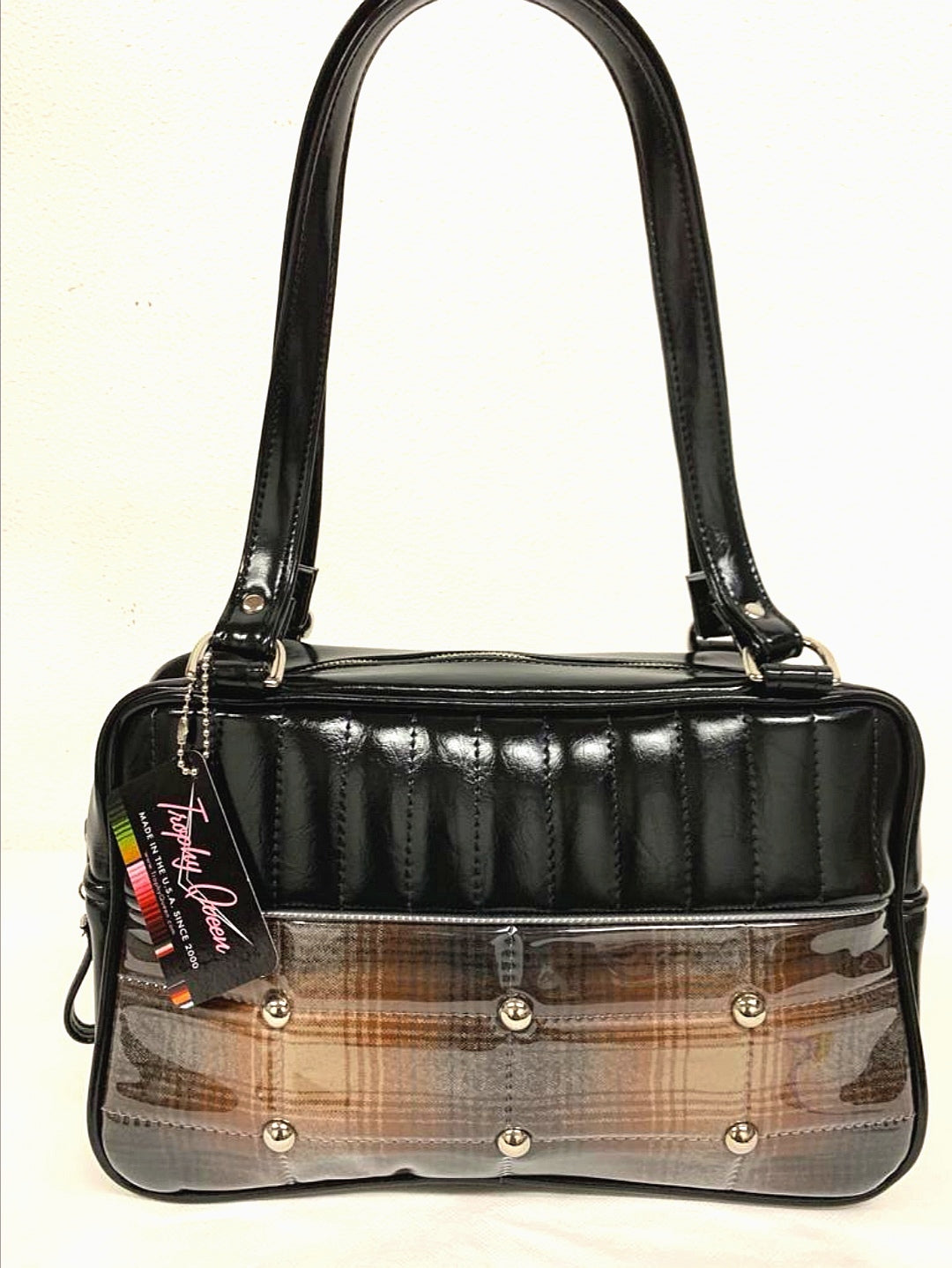 Lincoln Tote in Limited Edition Genuine Brown Pendleton Fabric and Black Grease Vinyl with Plush Leopard Lining. Made with matching vinyl zipper pull, nickel feet, inside zipper pocket with serial number and open divided pocket with signature Trophy Queen label. The straps are approximately 25” and come with an extra set of replacement straps. Locally made and ships from California