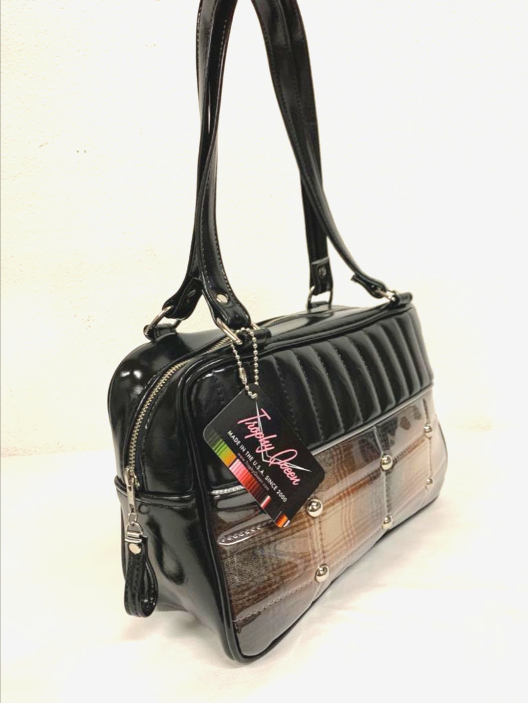 Lincoln Tote in Limited Edition Genuine Brown Pendleton Fabric and Black Grease Vinyl with Plush Leopard Lining. Made with matching vinyl zipper pull, nickel feet, inside zipper pocket with serial number and open divided pocket with signature Trophy Queen label. The straps are approximately 25” and come with an extra set of replacement straps. Locally made and ships from California