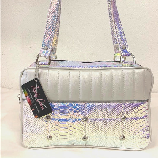 Lincoln Tote in Limited Edition Mermaid and Pearl White Vinyl with Plush Leopard Lining. Matching vinyl zipper pull, nickel feet, inside zipper pocket with serial number and open divided pocket with signature Trophy Queen label. The straps are approximately 25” and come with an extra set of replacement straps. Locally made and ships from California