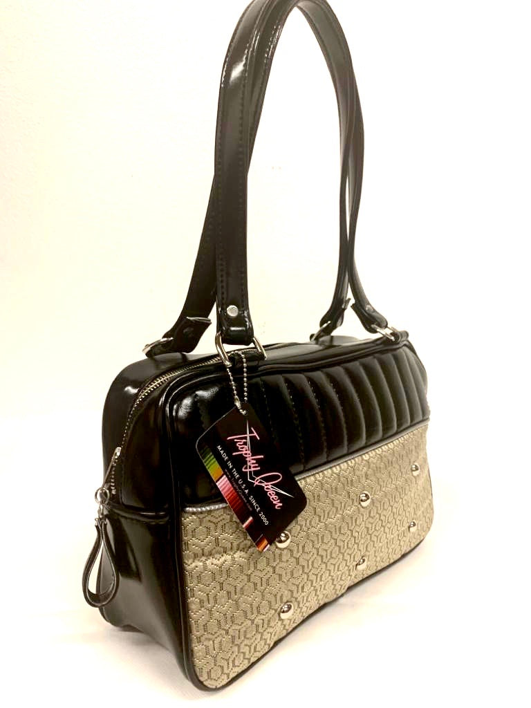 Lincoln Tote in Limited Edition Vintage Gold ‘65 Chevy Fabric and Grease Black Vinyl with Plush Leopard Lining. Made from NOS Vintage 1965 Chevy Upholstery Fabric with matching vinyl zipper pull, nickel feet, inside zipper pocket with serial number and open divided pocket with signature Trophy Queen label. The straps are approximately 25” and come with an extra set of replacement straps. Locally made and ships from California