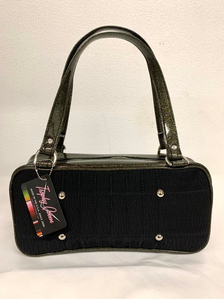 Limited Edition Galaxy Shoulder Bag with Black '71 Pontiac Fabric and Black Gold Glitter Vinyl with Plush Leopard Lining. Made from NOS vintage 1971 Pontiac Catalina Upholstery fabric and nickel hardware. Inside you’ll find an open divided pocket, a zipper pocket with serial number inside and signature Trophy Queen Label. Outside 25” straps (approx 63cm), vinyl zipper pull and protective nickel feet. Made and ships from California with an extra set of replacement straps.