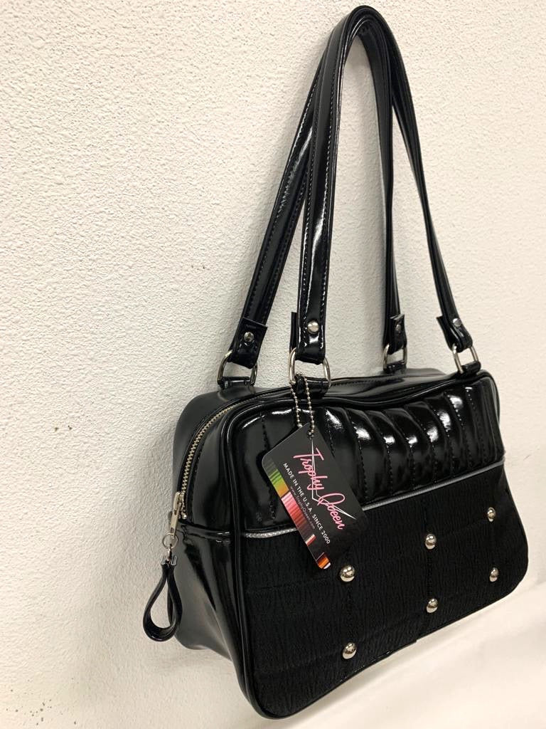 Limited Edition Lincoln Business Bag in Grease Black and Black ‘71 Pontiac Fabric with Plush Leopard Lining. The straps are 29” with nickel hardware and come with extra replacement straps! Made from NOS Vintage 1971 Pontiac Catalina Upholstery Fabric with open divided pocket and zipper pocket inside with hidden serial number. Tote comes with vinyl zipper pull, nickel fee and signature Trophy Queen label. Made with love in California.