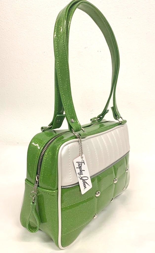 Lincoln Tote in Lime Green Glitter and Pearl White Vinyl with Plush Leopard Lining. Matching vinyl zipper pull, nickel feet, inside zipper pocket with serial number and open divided pocket with signature Trophy Queen label. The straps are approximately 25” and come with an extra set of replacement straps. Locally made and ships from California
