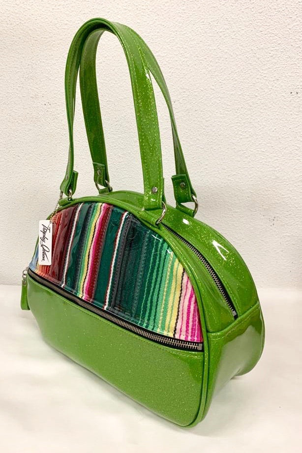 Lucky Strike Bowling Style Bag made with Lime Green Glitter and Mexican Blanket with Clear Overly Vinyl and lined with Plush Leopard inside with front zipper pocket, shoulder straps with extra set included inside has divided pocket, zipper pocket with hidden serial number inside and signature trophy queen label.