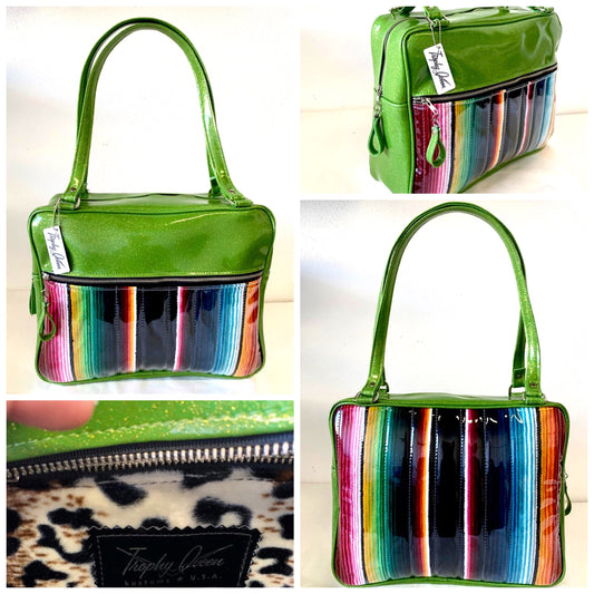 Fairlane Business Bag with Genuine Mexican Blanket with Clear Overlay and Lime Green Glitter Vinyl lined with plush Leopard fabric. The straps are 29” with nickel hardware and come with extra replacement straps! Inside has an open divided pocket and zipper pocket with hidden serial number. Tote comes with vinyl zipper pull, nickel fee and signature Trophy Queen label. Made with love in California.