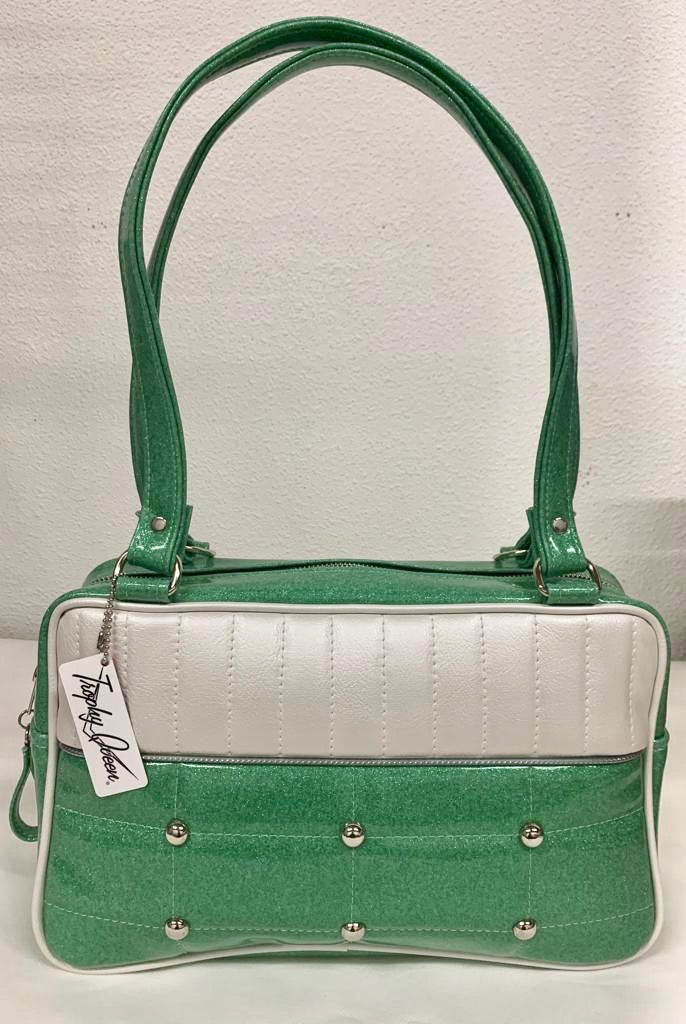 Lincoln Tote in Seafoam Green Glitter and Pearl White Vinyl with Plush Leopard Lining. Matching vinyl zipper pull, nickel feet, inside zipper pocket with serial number and open divided pocket with signature Trophy Queen label. The straps are approximately 25” and come with an extra set of replacement straps. Locally made and ships from California