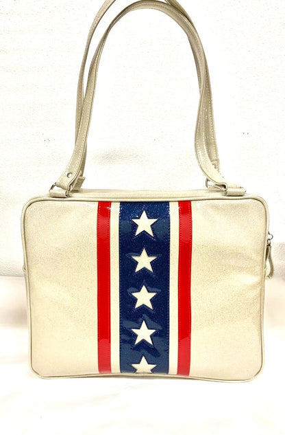 Evel Knievel GTO Business Bag with plush leopard lining, 29” straps with nickel hardware and comes with extra replacement straps! Inside has an open divided pocket and zipper pocket with hidden serial number. Tote comes with vinyl zipper pull, nickel fee and signature Trophy Queen label. Made with love in California.