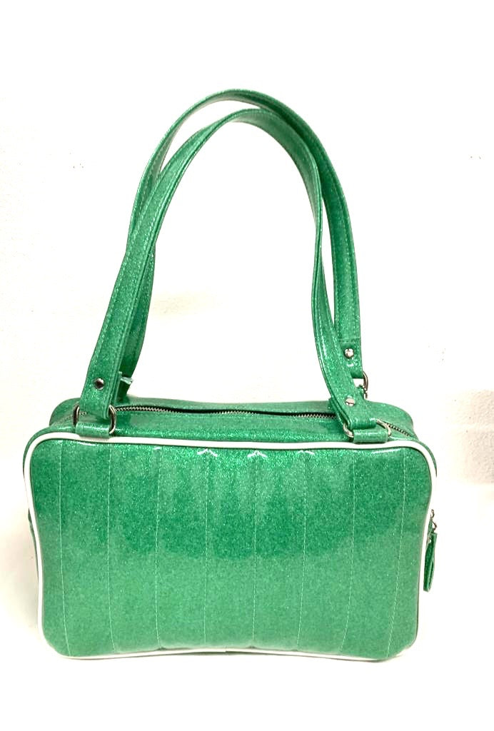 Fairlane Tote Bag in Seafoam Green Glitter and Pearl White Vinyl with plush Leopard Lining. This purse has matching vinyl zipper pull, nickel feet, inside zipper pocket with serial number and open divided pocket with signature Trophy Queen label. The straps are approximately 25” and come with an extra set of replacement straps. Locally made and ships from California.