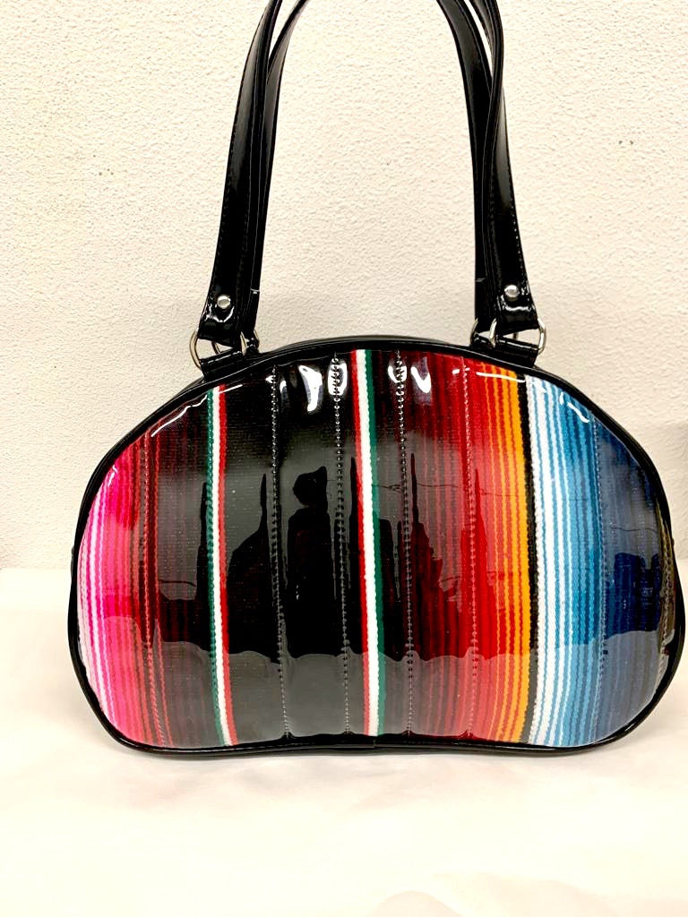 Lucky Strike Bowling Style Bag made with Grease Black and Mexican Blanket with Clear Overly Vinyl and lined with Plush Leopard inside with front zipper pocket, shoulder straps with extra set included inside has divided pocket, zipper pocket with hidden serial number inside and signature trophy queen label.