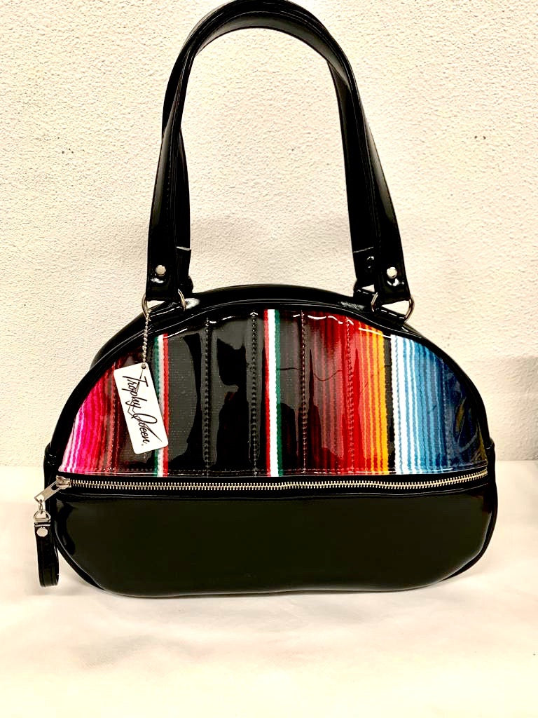 Lucky Strike Bowling Style Bag made with Grease Black and Mexican Blanket with Clear Overly Vinyl and lined with Plush Leopard inside with front zipper pocket, shoulder straps with extra set included inside has divided pocket, zipper pocket with hidden serial number inside and signature trophy queen label.