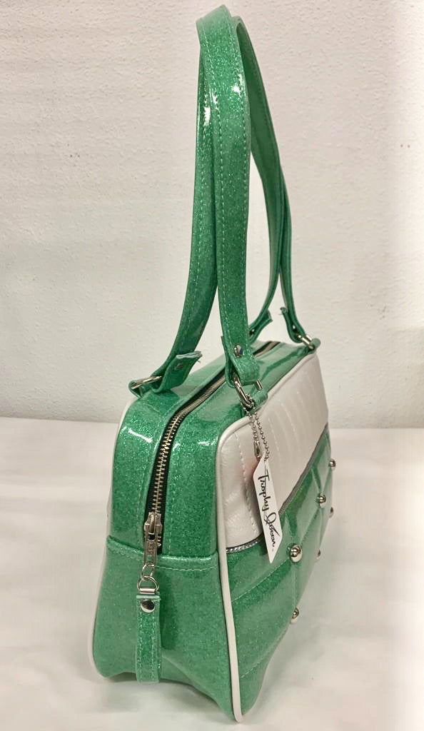 Lincoln Tote in Seafoam Green Glitter and Pearl White Vinyl with Plush Leopard Lining. Matching vinyl zipper pull, nickel feet, inside zipper pocket with serial number and open divided pocket with signature Trophy Queen label. The straps are approximately 25” and come with an extra set of replacement straps. Locally made and ships from California