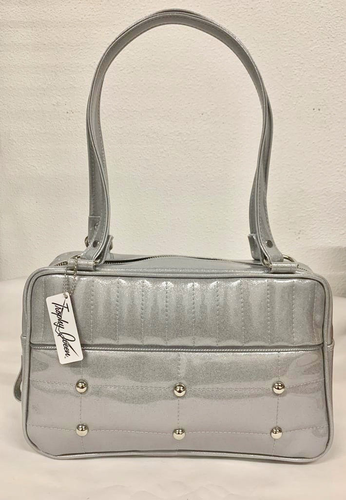 Lincoln Tote in Chrome Glitter Vinyl and Plush Leopard Lining. Made matching vinyl zipper pull, nickel feet, inside zipper pocket with serial number and open divided pocket with signature Trophy Queen label. The straps are approximately 25” and come with an extra set of replacement straps. Locally made and ships from California