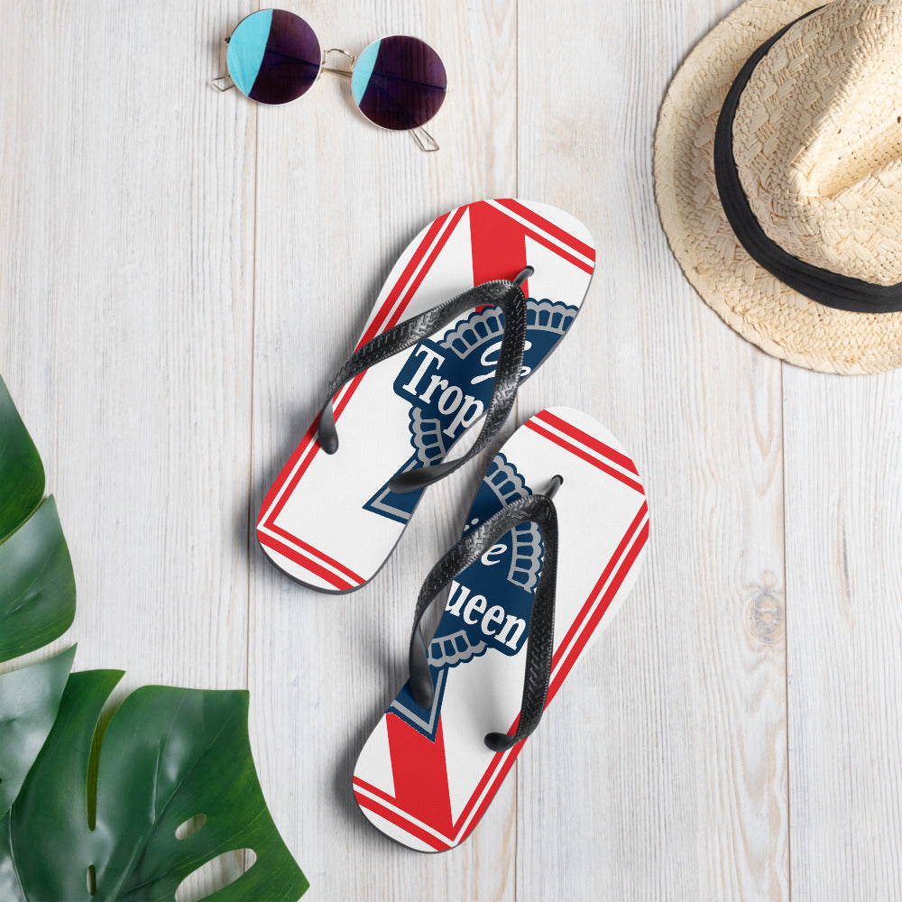 Prepare for an adventurous and carefree summer with a pair of colorful Trophy Queen Blue Ribbon logo with rubber soles and soft fabric lining these flip flops are sure to make you feel comfortable wherever your day takes you. Red, White and Blue